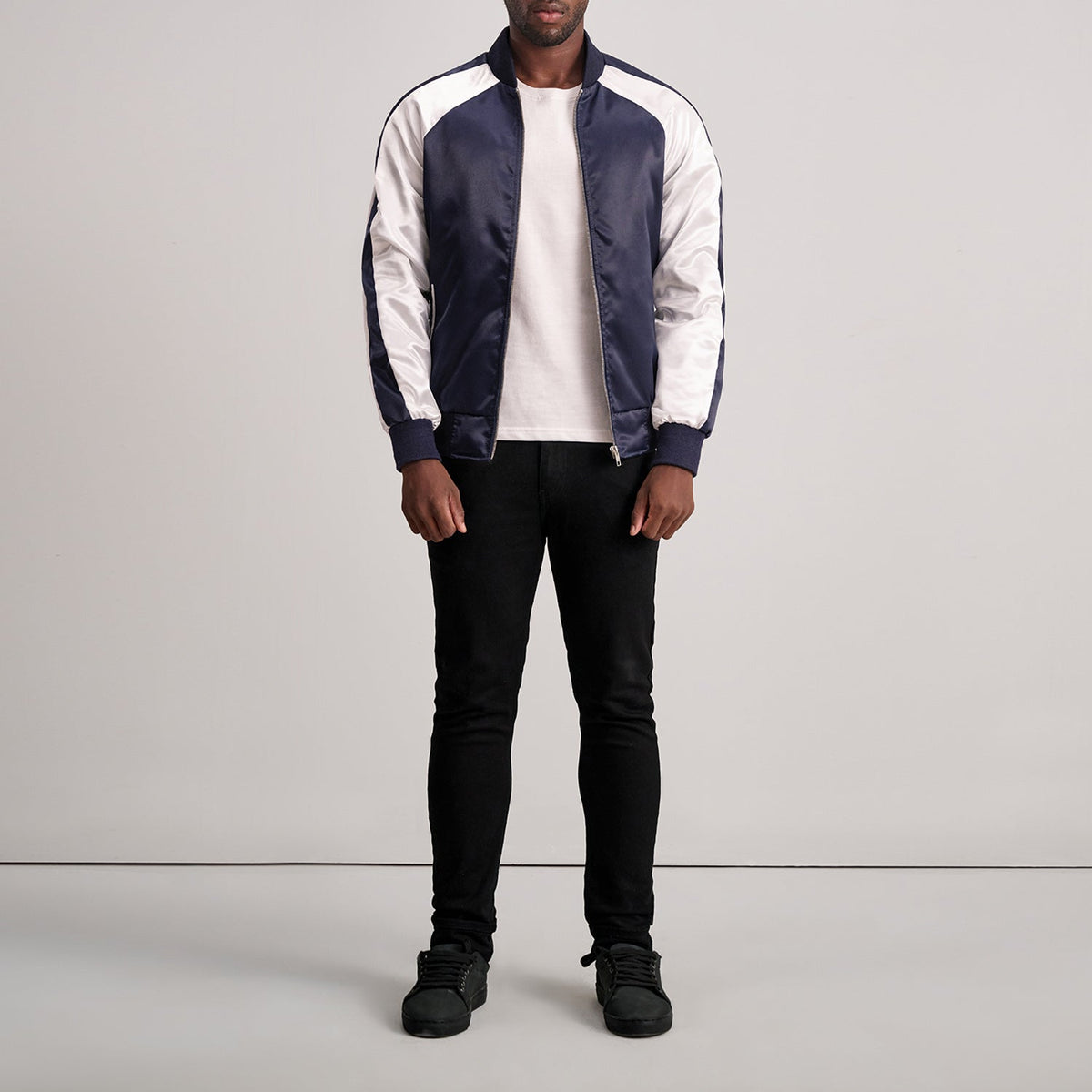 
Close-Up Detail of Varsity & Zipper Hardware on Clarke Blue Varsity Jacket