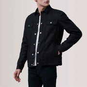 
Colberto Black Waxed Canvas Trucker Jacket For Men - Lateral Side Profile View Showing Sleeve Cut & Athletic Taper Fit
