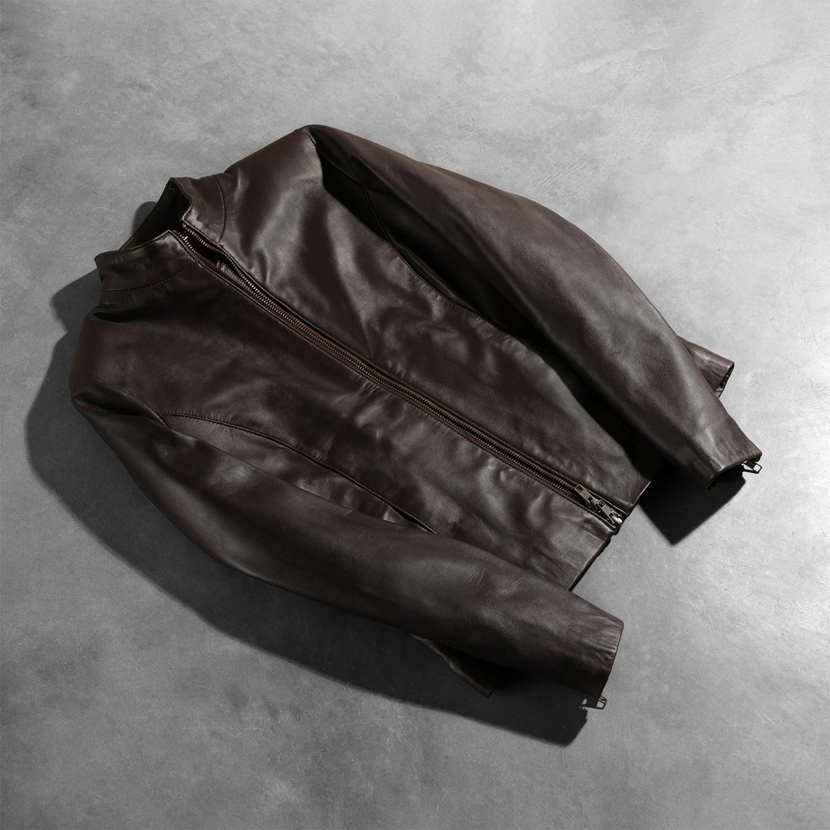 
Zipper & Hem Craftsmanship Construction Detail on Women's Rumella Maroon Leather Biker Jacket